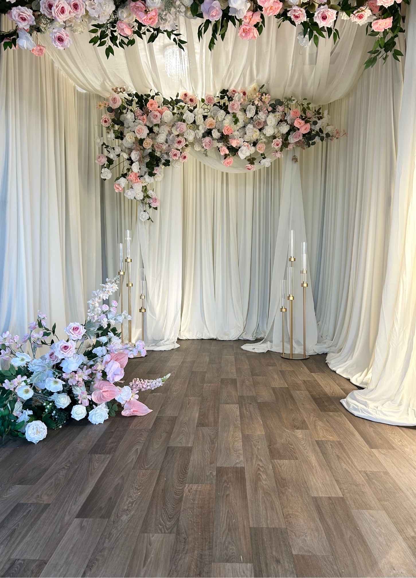 Layered Drapery Stage Backdrop custom structure with ivory, blush, and emerald styling for a wedding in the greater Seattle area