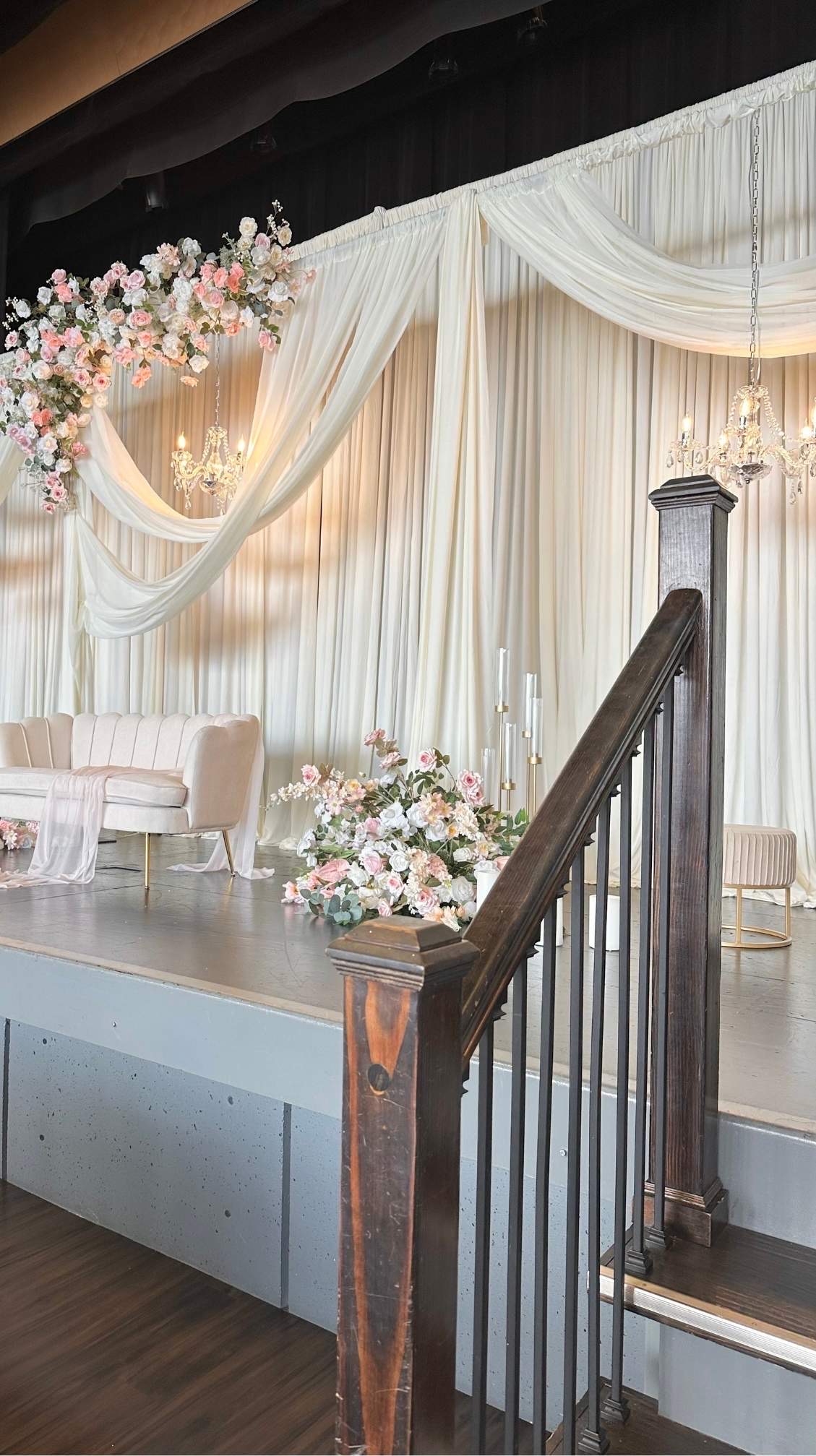 Layered Drapery Stage Backdrop custom structure with ivory, blush, and sage styling for a wedding at Rosehill Community Center