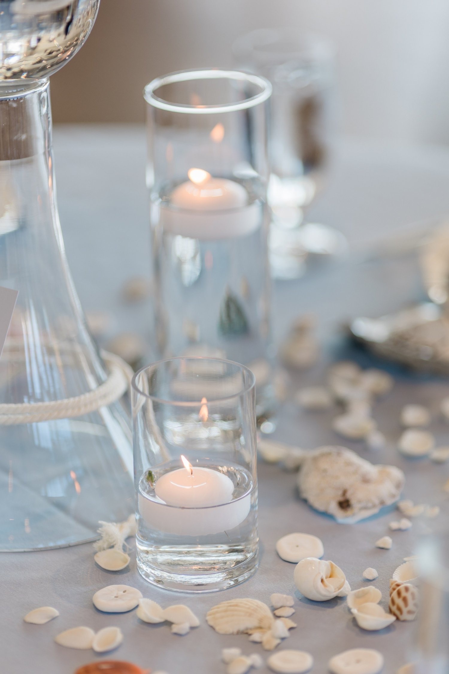 Floor Candles accent styling for a wedding reception at Edmonds Waterfront Center