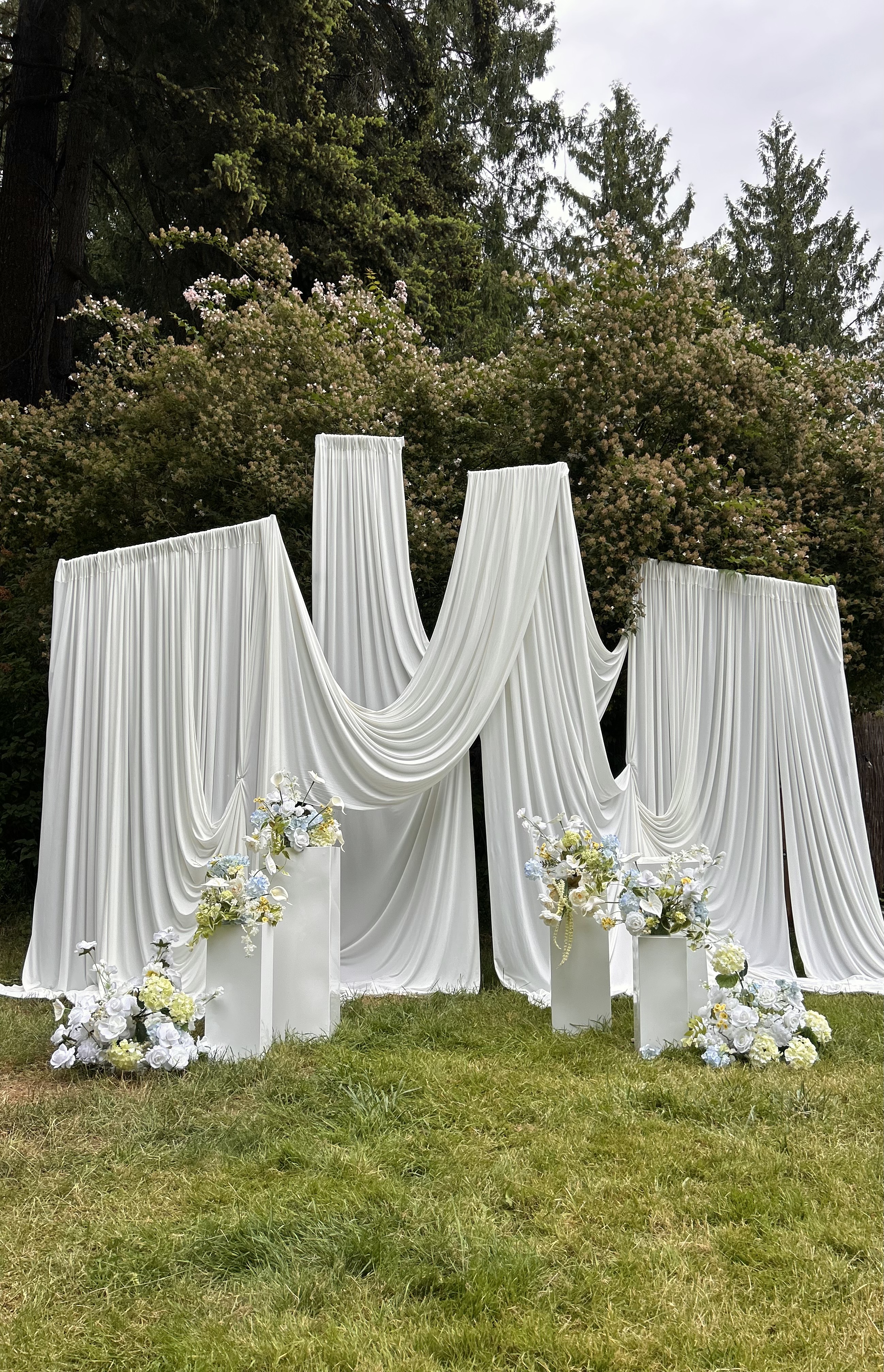 Drapery Backdrop custom structure with ivory and emerald styling for a birthday in the greater Seattle area