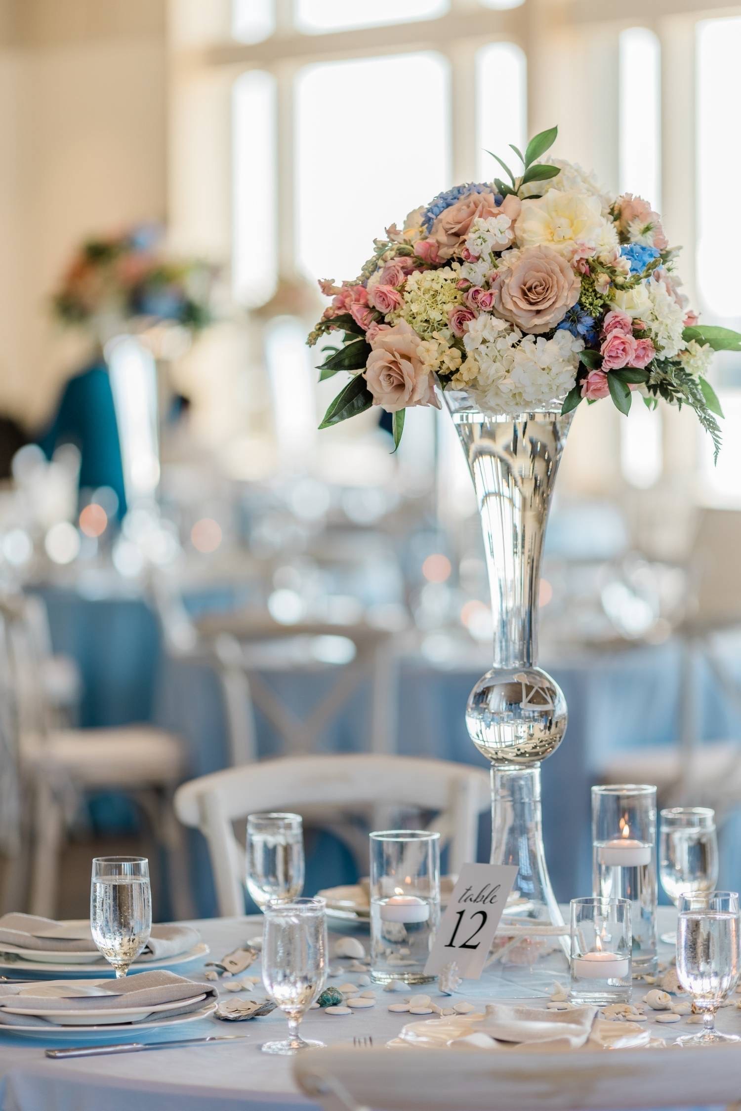 Luxury blush, powder blue, and ivory organic floral styling for a wedding centerpiece in the greater Seattle area