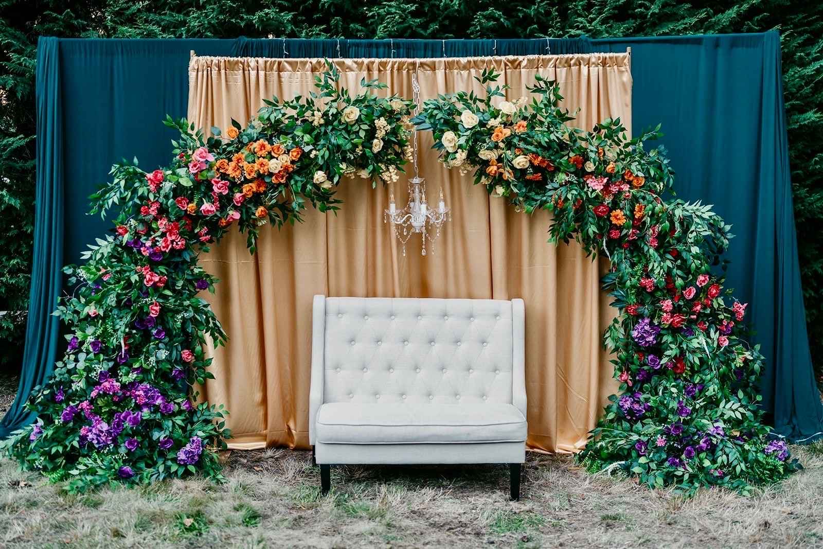 Classic Stage Backdrop custom structure with emerald, champagne, and plum styling for a wedding in the greater Seattle area