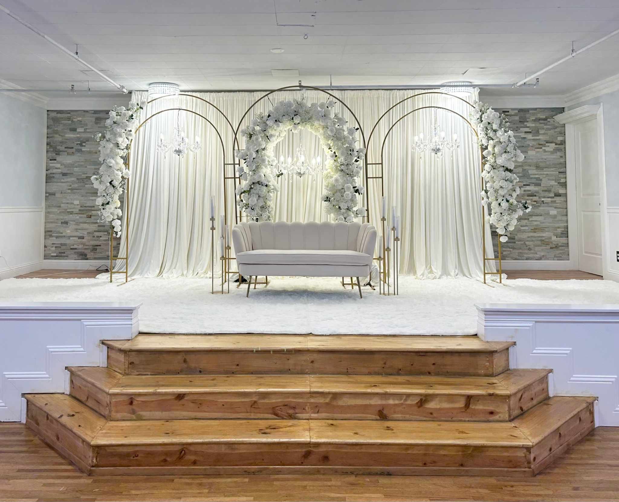 Classic Stage Backdrop custom structure with ivory, gold, and white styling for a wedding at Song River Banquet Center