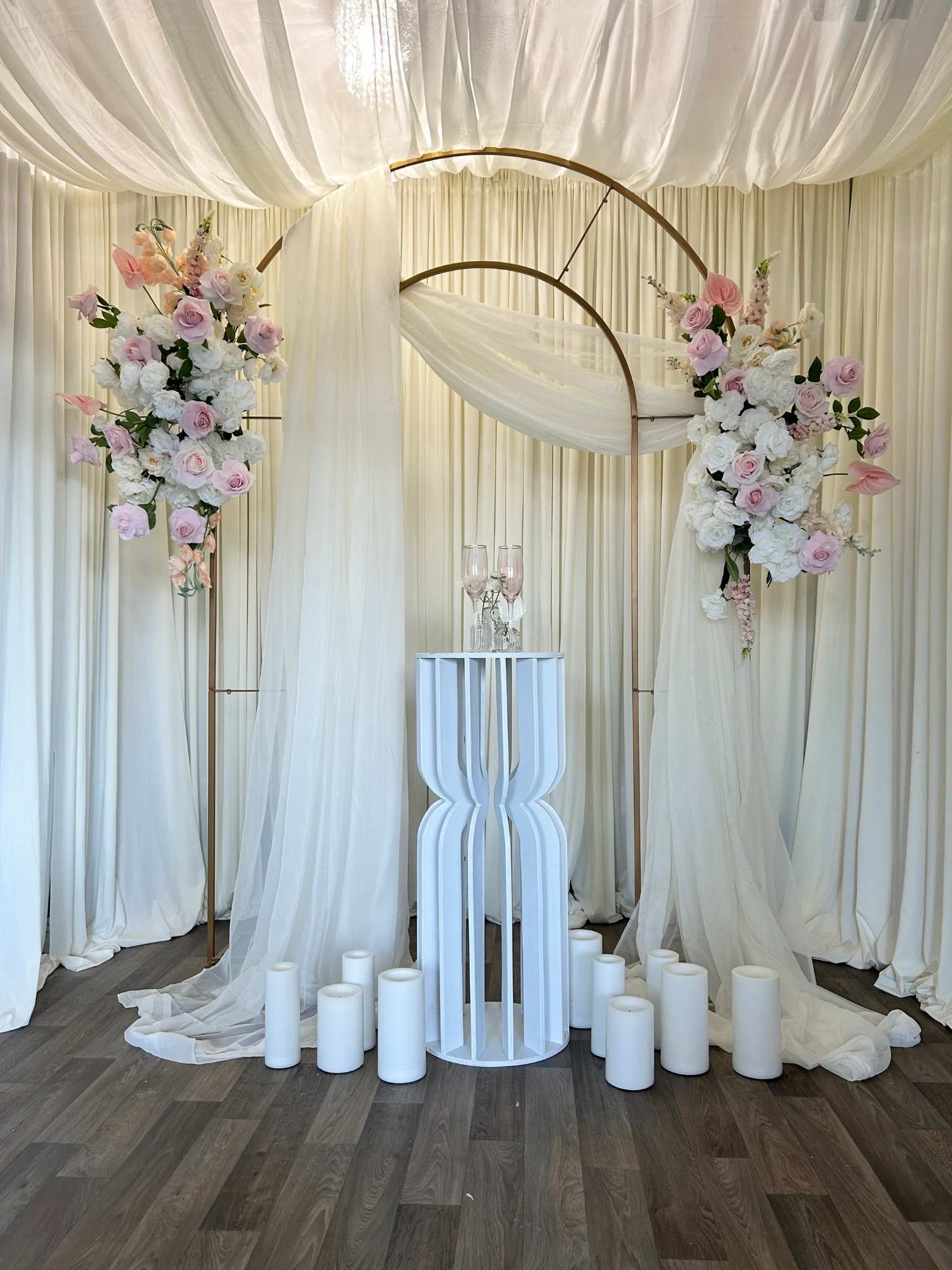 Signature Backdrop custom structure with blush, ivory, and gold styling for a wedding ceremony in the greater Seattle area