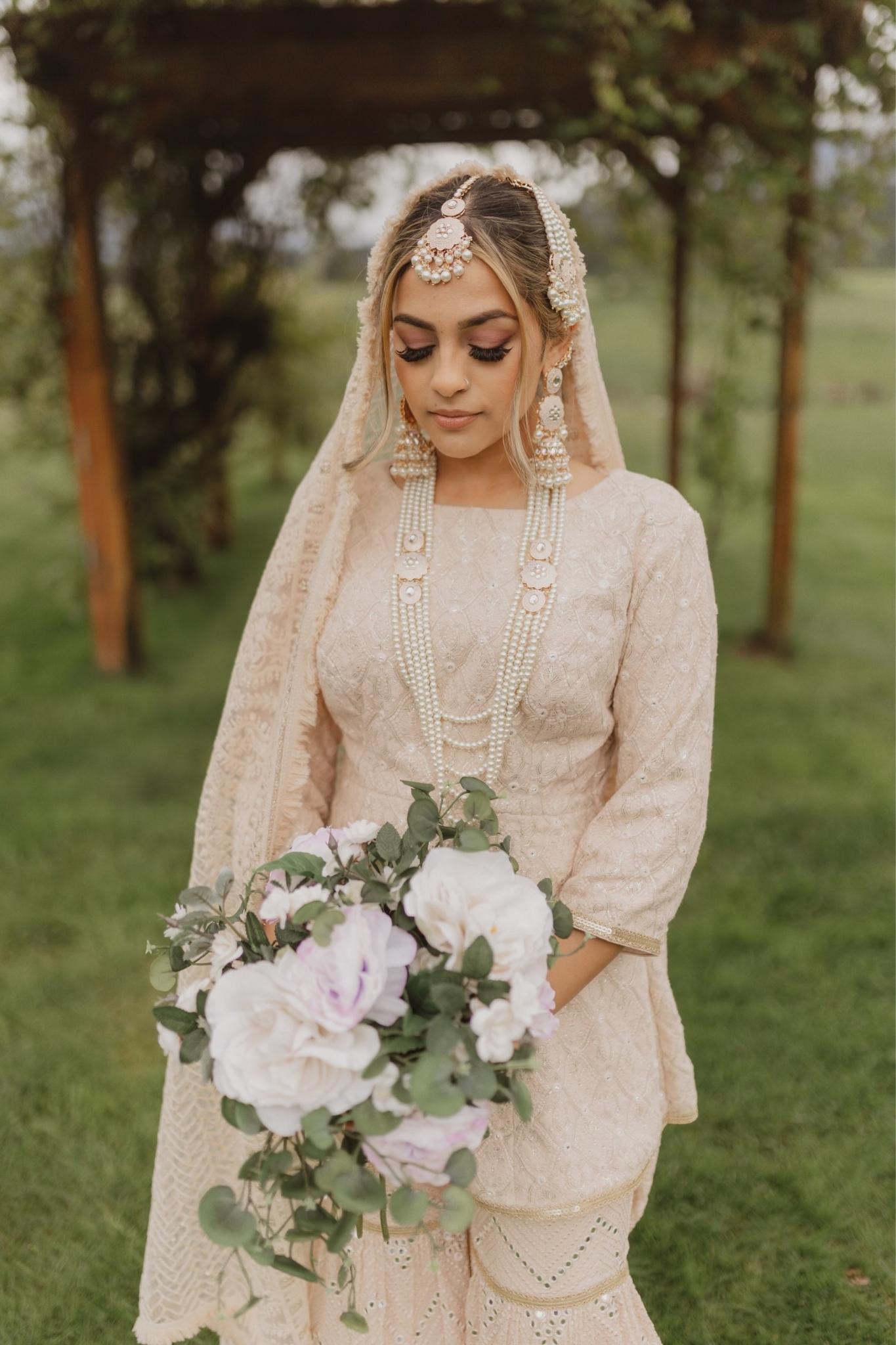 Luxury champagne, ivory, and sage organic floral centerpiece for a wedding in the greater Seattle area