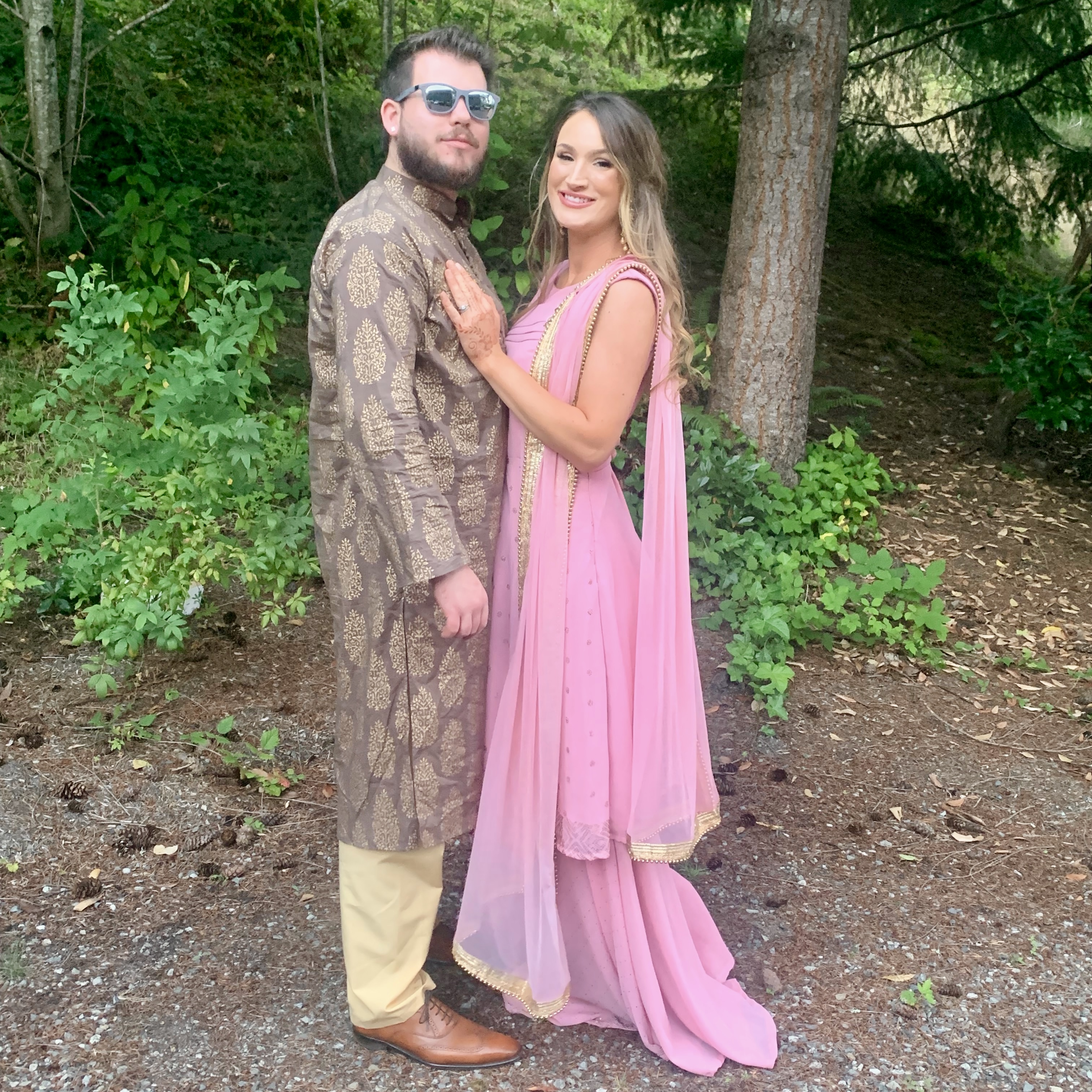 ustin and Maquel Bradbury, the founders of Bradbury Events, photographed together outdoors in South Asian formal attire representing the heart of our story and the people behind every installation