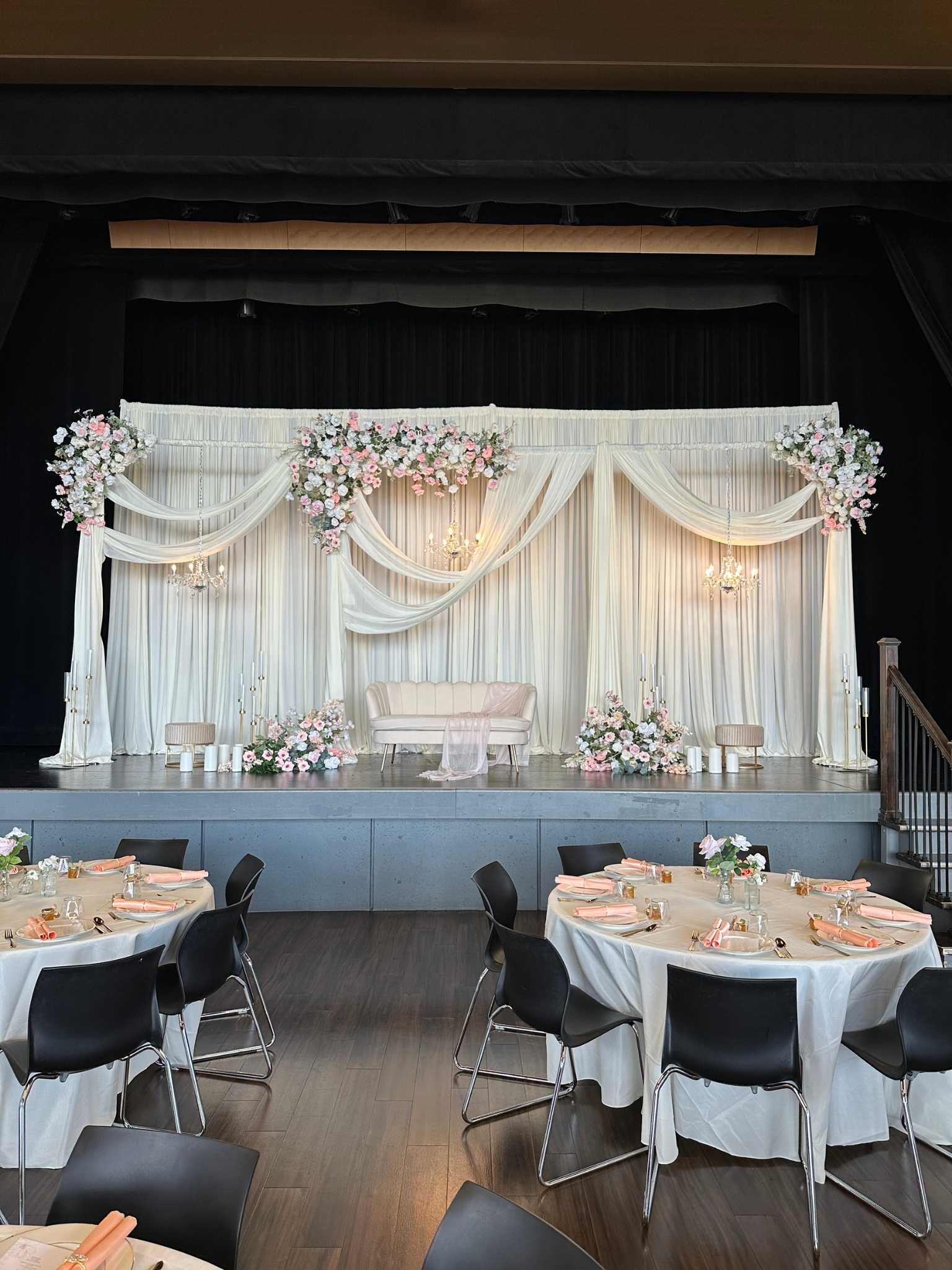Signature Stage Setup custom structure with ivory, blush, and sage styling for a wedding at Rosehill Community Center
