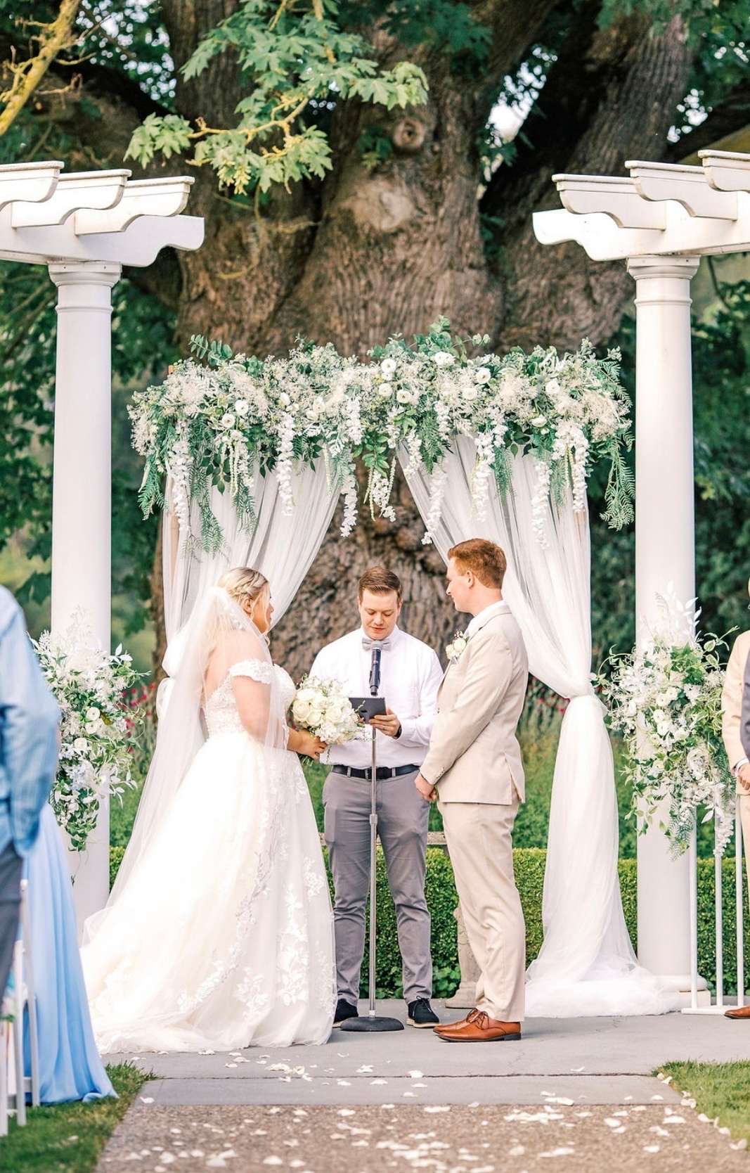 Signature Backdrop custom structure with ivory, emerald, and white styling for a wedding at Stilly Brook Farm